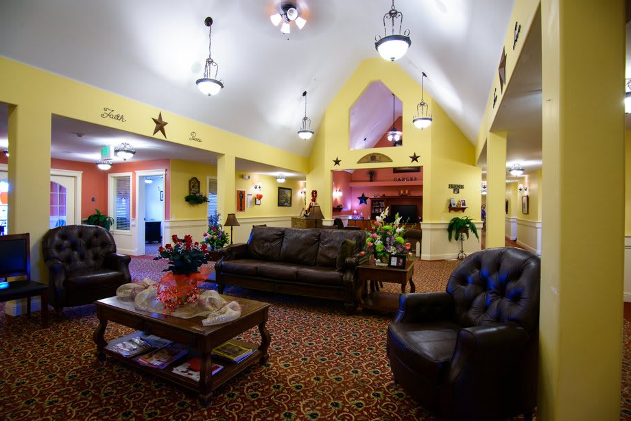 A warmly decorated lobby with comfortable seating and ambient lighting.