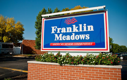 Welcome sign for Franklin Meadows, part of American Senior Communities.