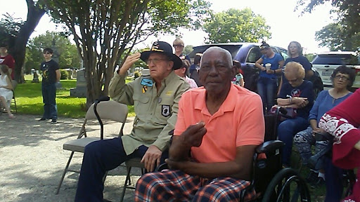 Veterans attending a community event, showcasing their camaraderie and respect.