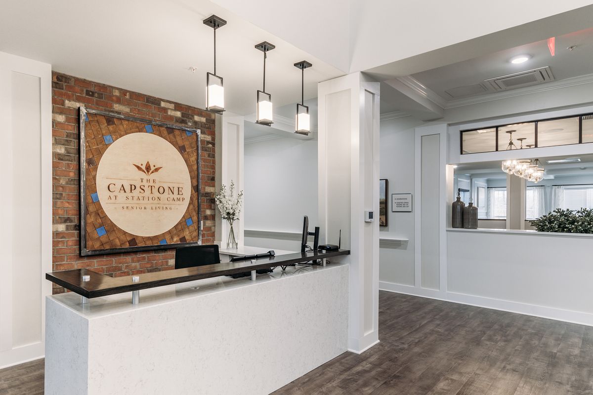 A modern office reception area with elegant lighting and decor.