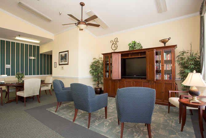 A cozy living room with comfortable seating, a television, and stylish decor.