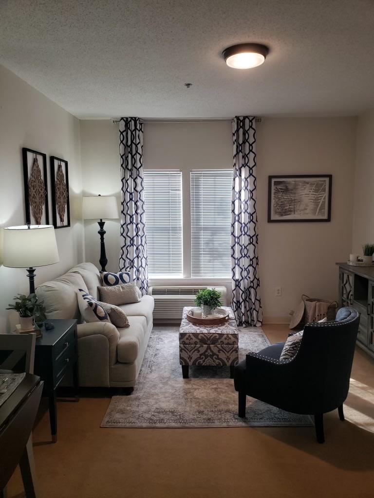 A cozy living room with stylish decor and natural light.