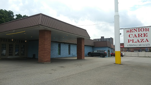 An exterior view of a commercial building with a parking area.