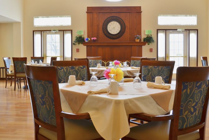 A beautifully set dining room with elegantly arranged tables and chairs.