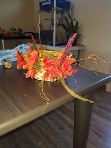 A vibrant, handmade floral arrangement displayed on a tabletop.