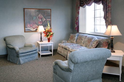 A cozy living room featuring comfortable seating and decorative elements.