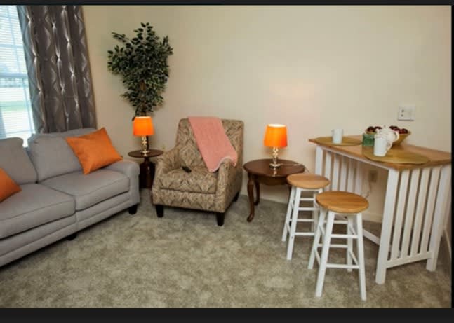 Cozy living room with comfortable seating and warm lighting.