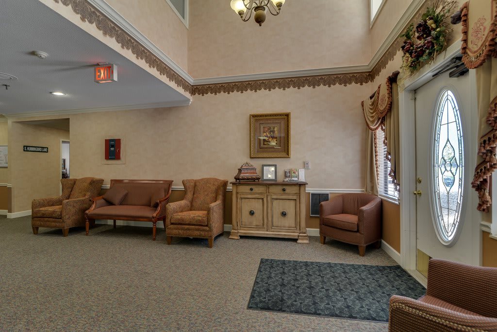 A cozy lobby area with comfortable seating and classic decor.