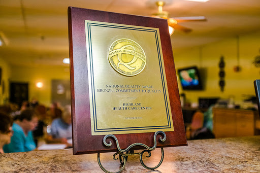 An award plaque displayed on a stand, symbolizing recognition and achievement.