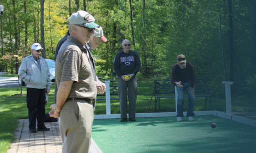 A group of individuals enjoying a leisurely game outdoors.