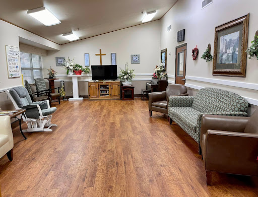 A cozy and welcoming interior space with comfortable furniture, a television, and decorative elements.