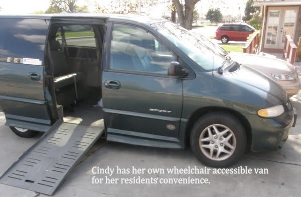 A wheelchair-accessible van with a ramp extended for easy access.
