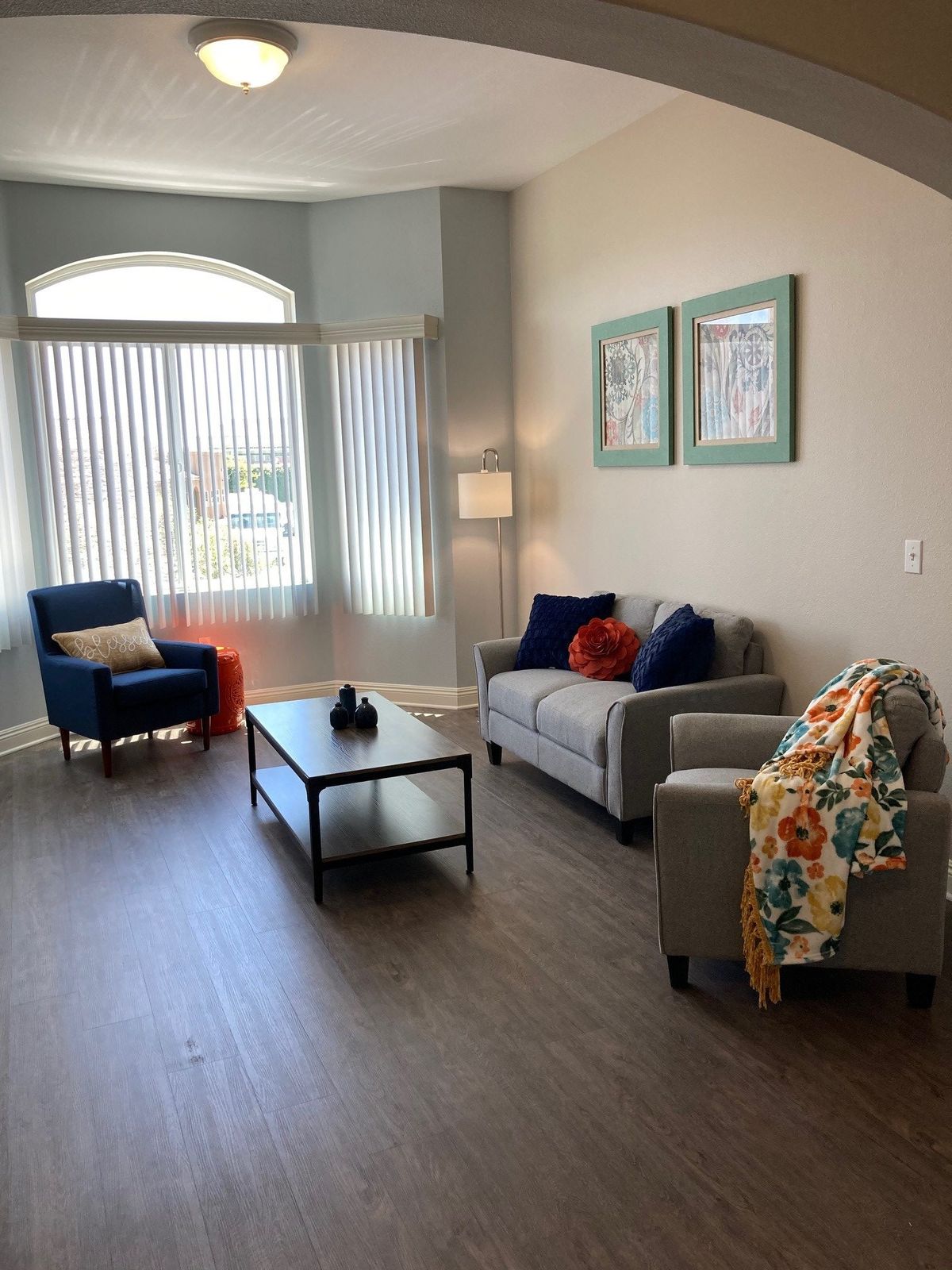 A modern living room with comfortable seating and stylish decor.