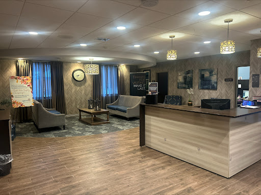 A modern lobby featuring comfortable seating and a welcoming reception area.