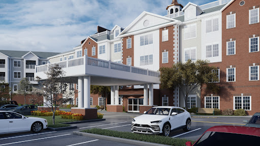 A picturesque hotel with a welcoming entrance and a parked white car in the foreground.