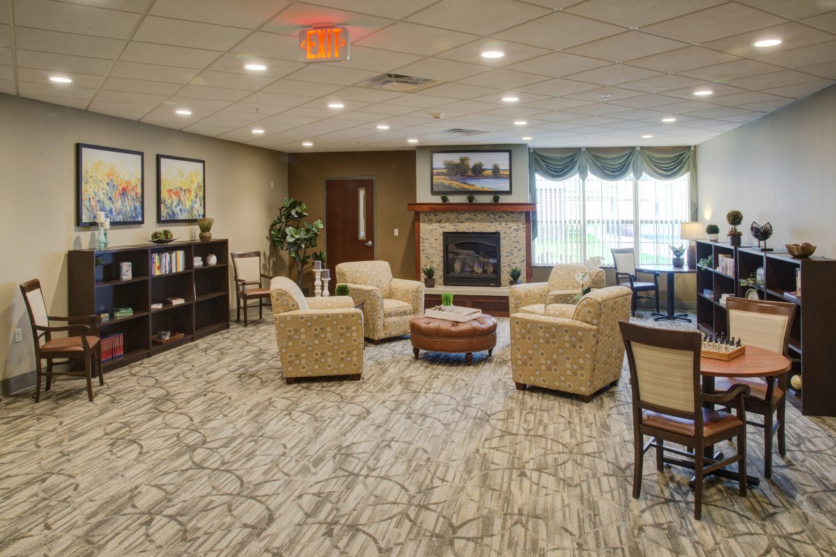 A cozy living room with comfortable seating and a fireplace.