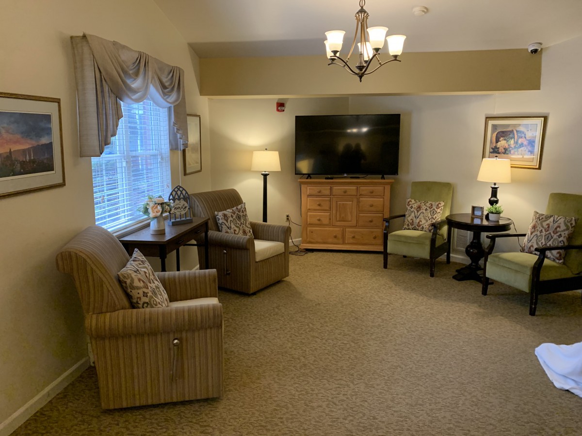 A cozy living room with comfortable seating and a television.