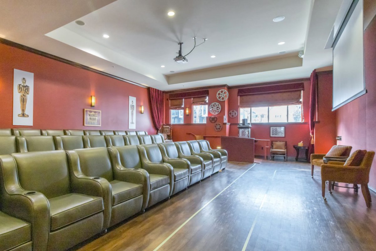 A luxurious home theater with plush seating and elegant decor.