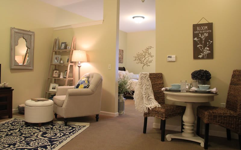 A cozy living room with comfortable seating and warm lighting.