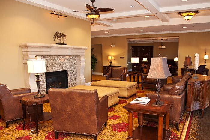 A cozy living room with a fireplace and comfortable seating.
