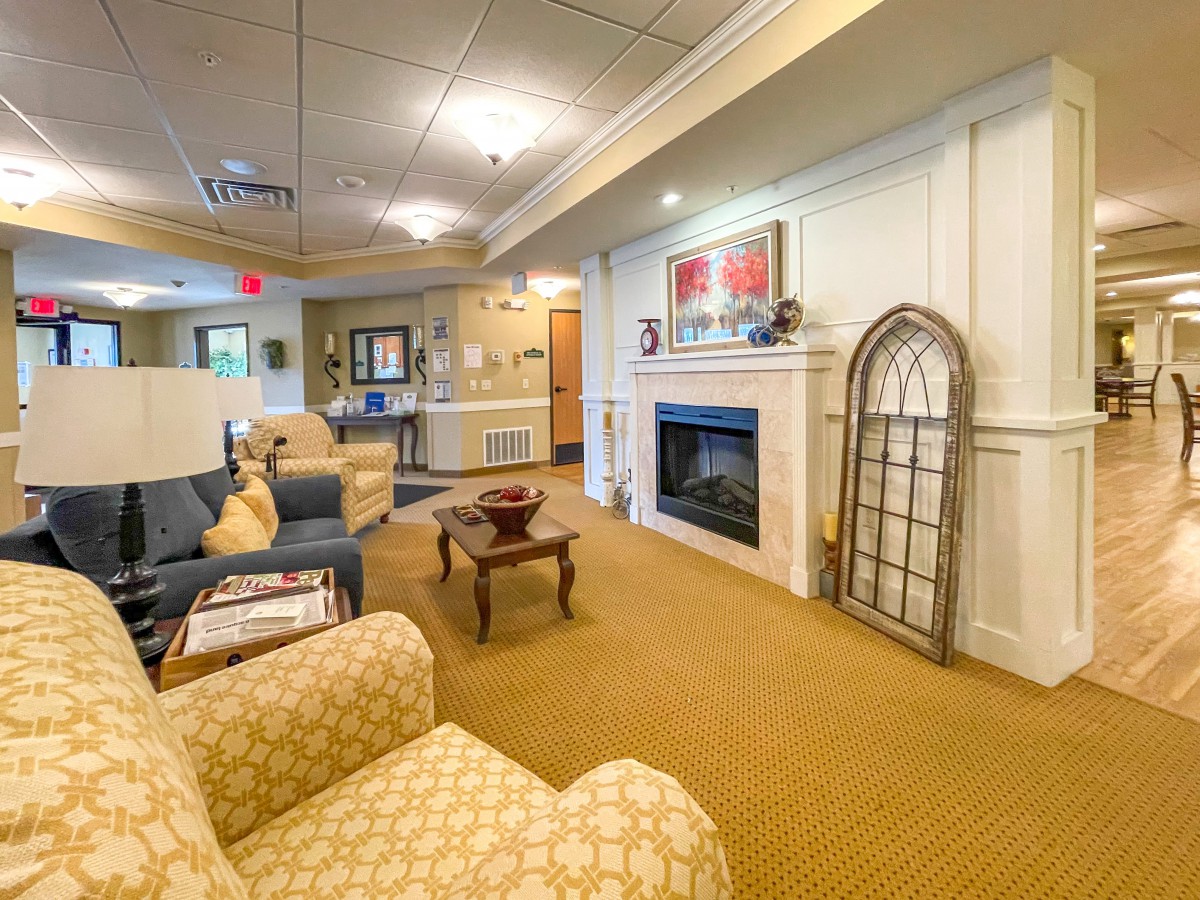 A cozy living room with comfortable seating and a fireplace, perfect for relaxing.