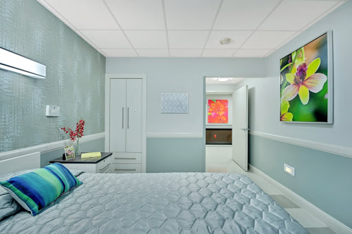 A modern and inviting bedroom featuring soothing colors and contemporary decor.