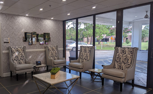 A modern lobby featuring comfortable seating and ample natural light.