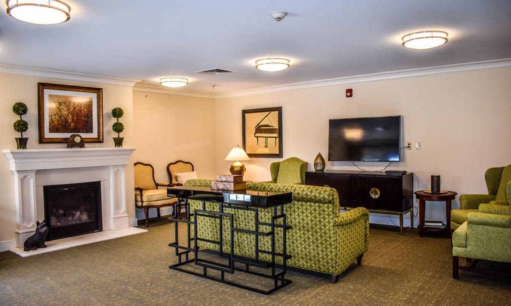 A cozy living room with stylish furniture and a television.