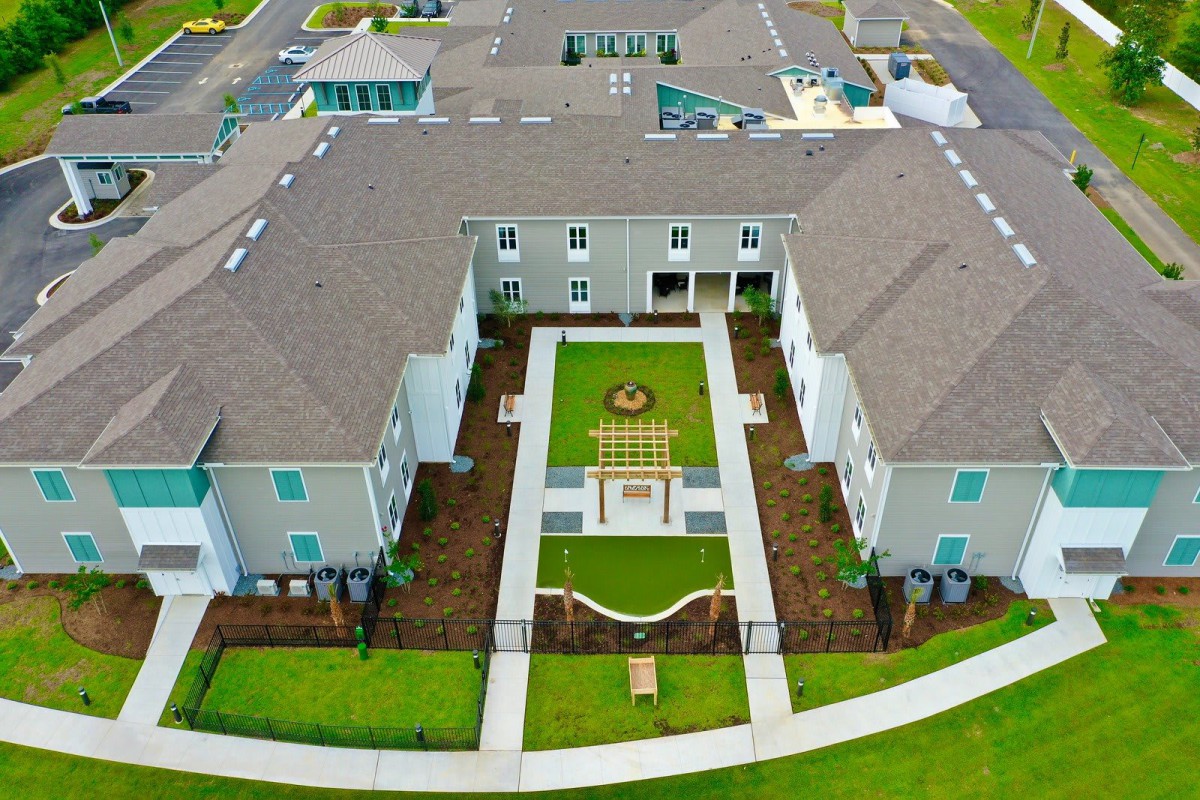 An aerial view of a residential building with a central courtyard.