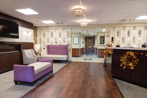 A stylish and modern lobby area featuring a mix of comfortable seating and elegant decor.