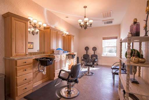 A well-designed salon interior featuring modern styling chairs and elegant lighting.