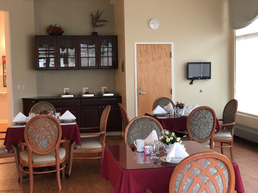 A well-appointed dining area featuring elegant tables and chairs, perfect for intimate gatherings or meals.