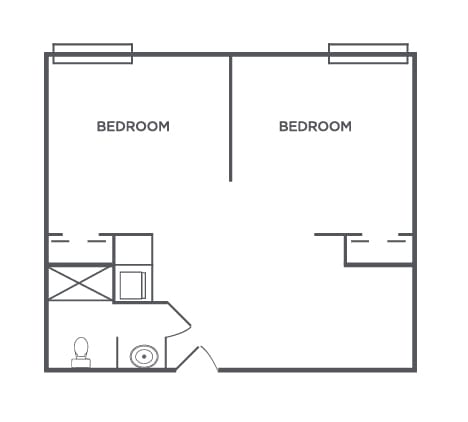 A floor plan showing two bedrooms and a bathroom layout.