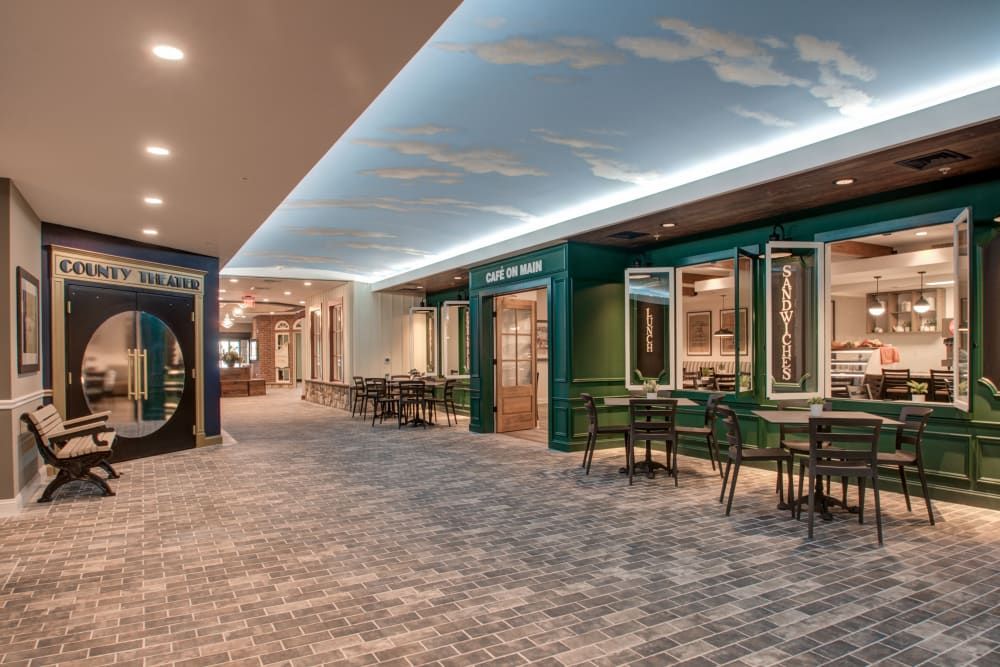 A modern restaurant interior with a sky-themed ceiling and seating area.