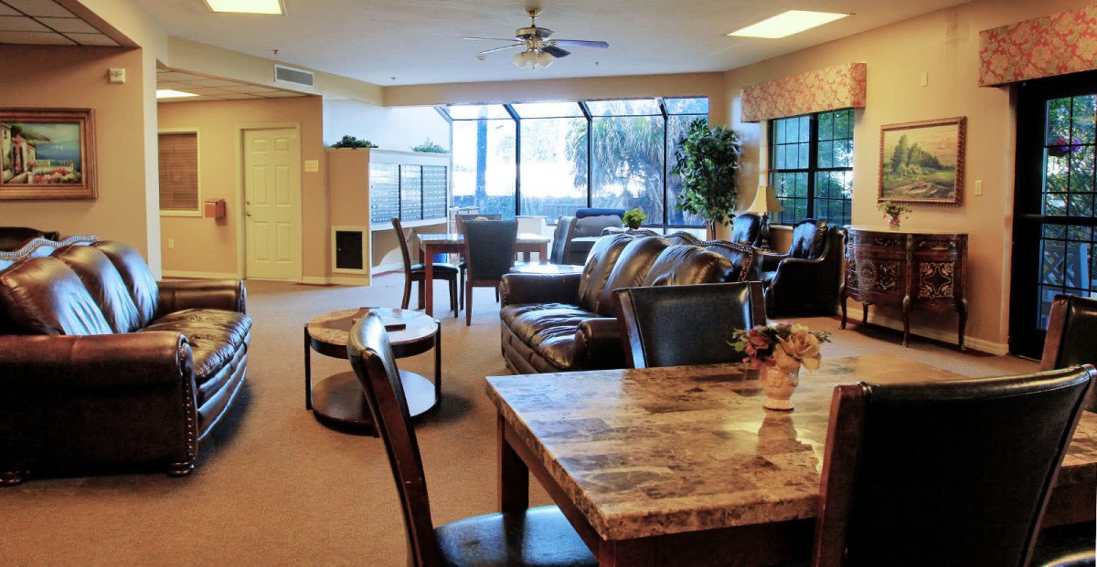 A cozy living room with comfortable seating and large windows.