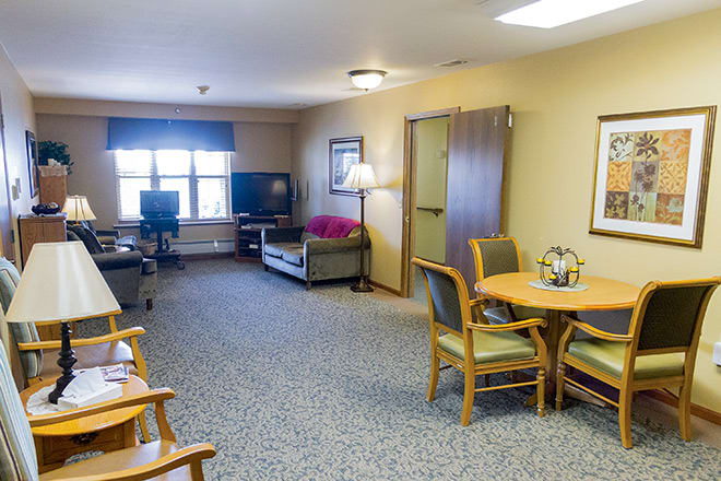 A spacious living room with comfortable seating and entertainment options.