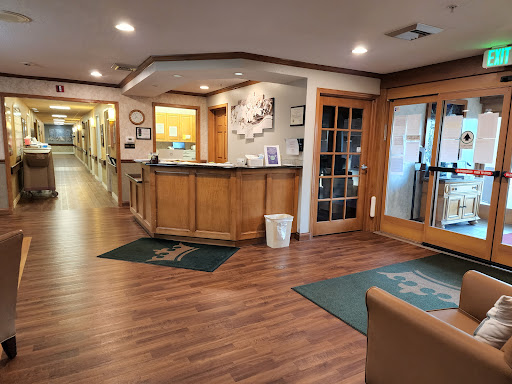 A cozy reception area featuring wooden accents and a welcoming atmosphere.