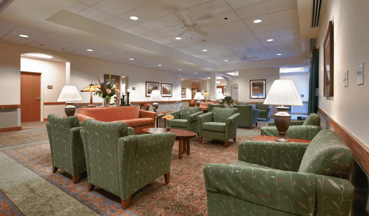 A spacious lobby with comfortable seating and warm lighting.