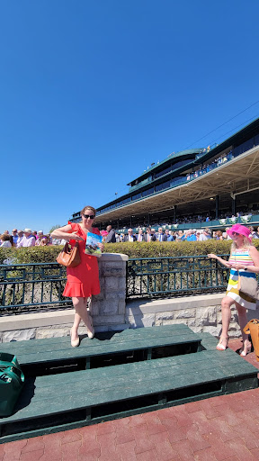 Enjoying a sunny day at the races with stylish friends.