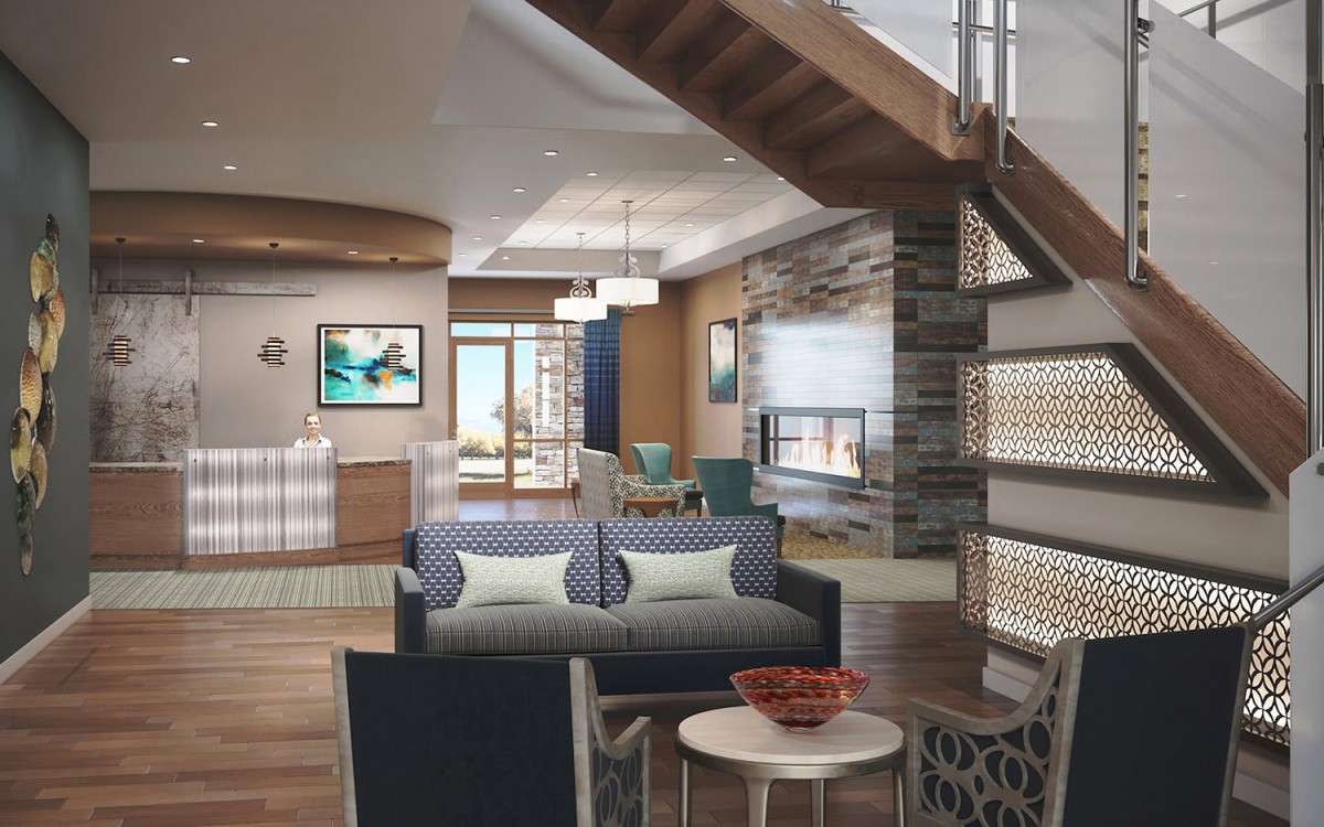 A modern living room with an open floor plan featuring stylish furniture and a wooden staircase.
