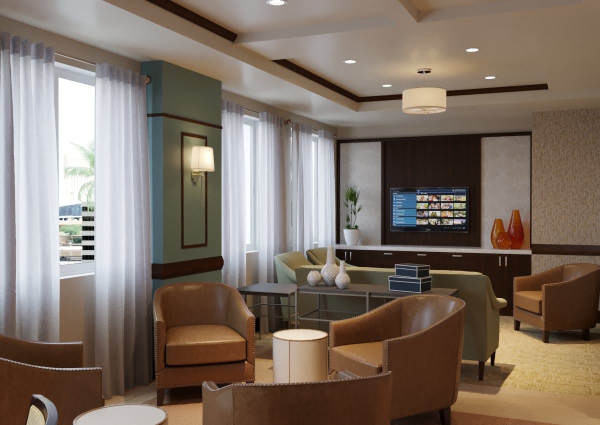 A modern living room featuring comfortable seating, stylish furniture, and ample natural light.