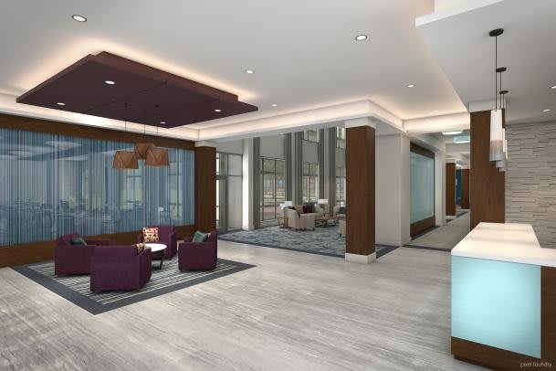 A modern lobby featuring contemporary furniture and stylish lighting.