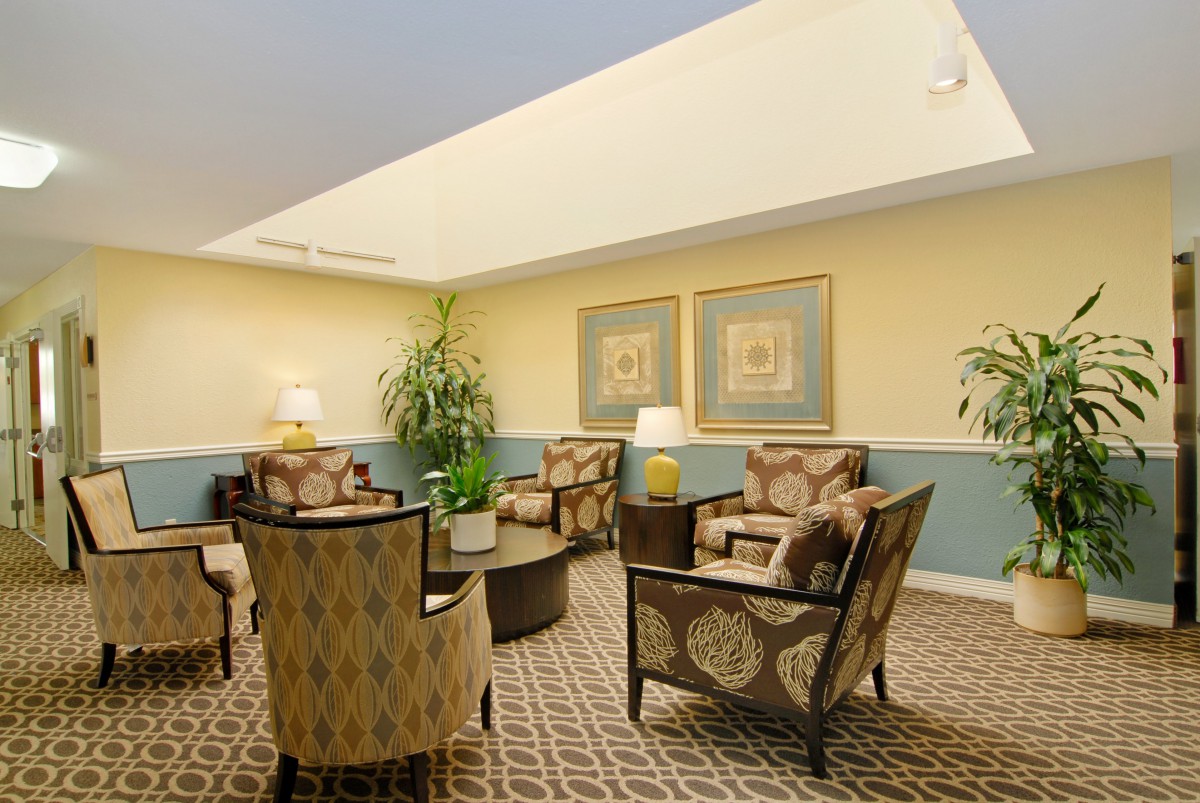 A cozy lobby seating area with armchairs and decorative elements.