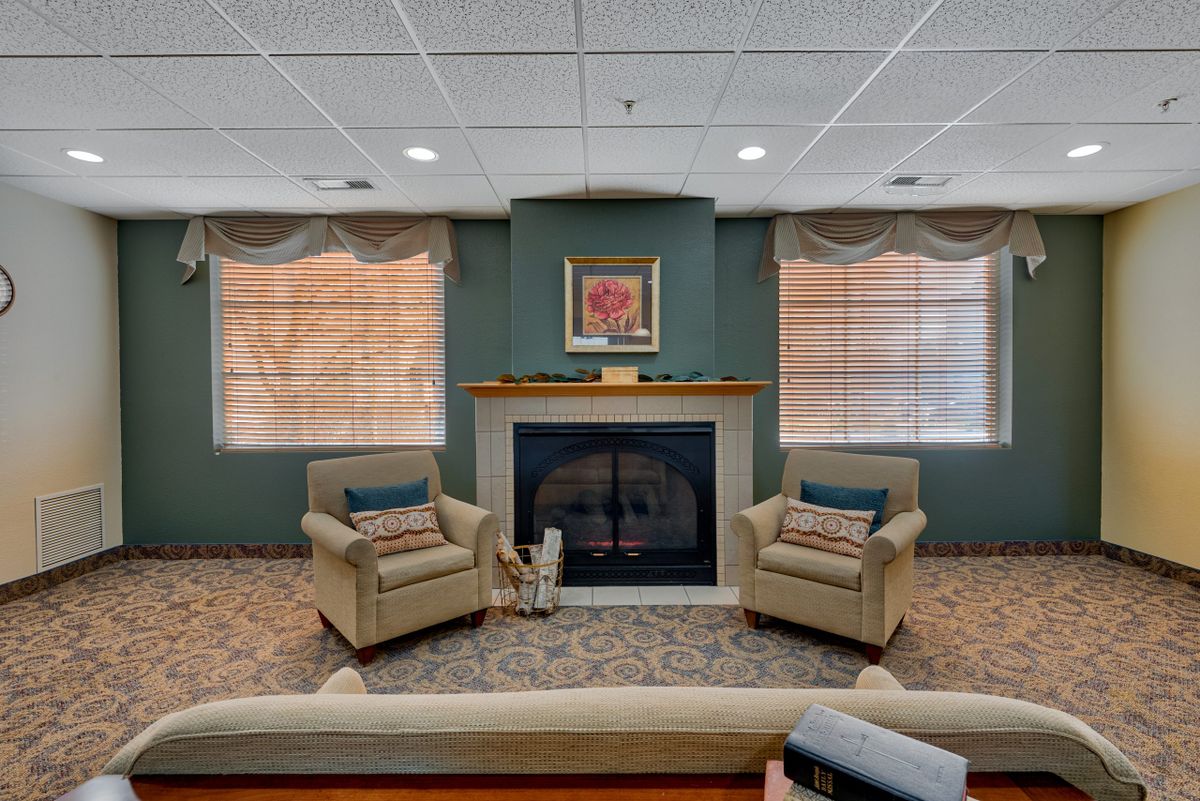 Cozy living room with a fireplace and two armchairs.