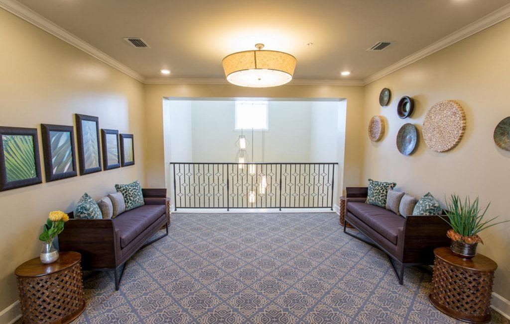A cozy hallway with elegant seating and modern decor.