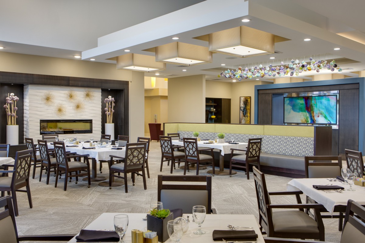 A modern, elegant restaurant dining area with well-arranged tables and stylish decor.