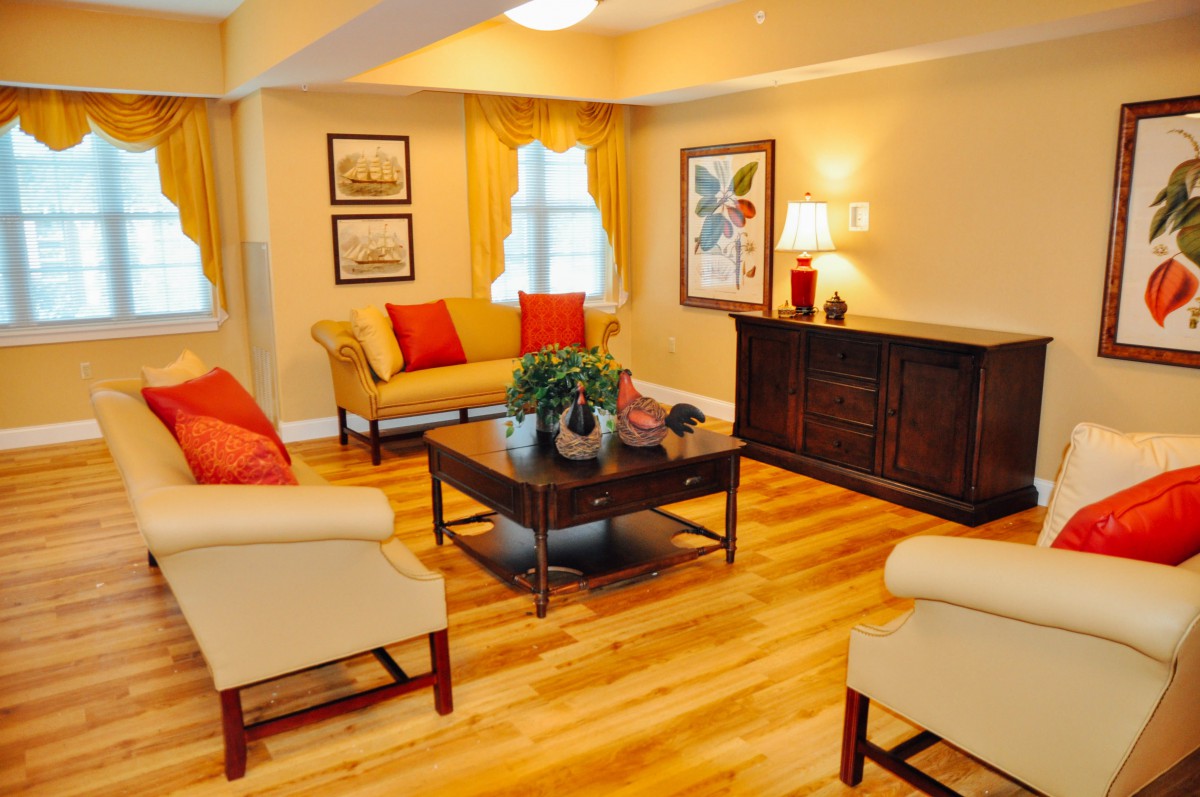 A cozy living room with elegant furniture and warm lighting.