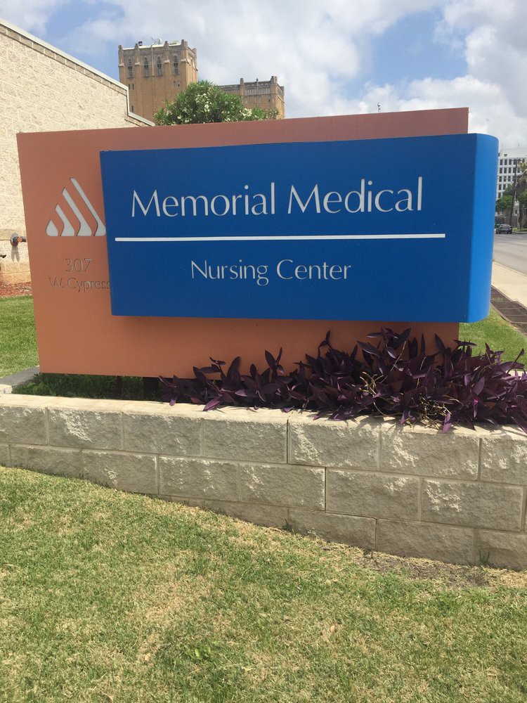 Sign for Memorial Medical Nursing Center outside a building.