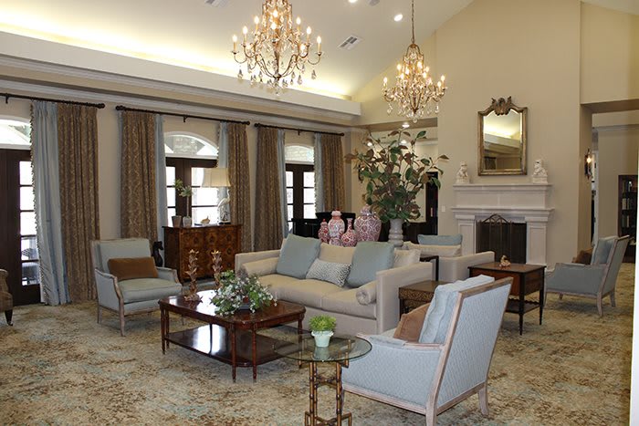 A luxurious living room with elegant chandeliers and stylish furnishings.