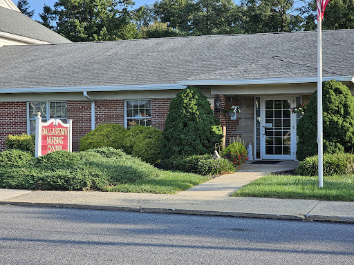 A well-maintained office building with lush landscaping and a clear entrance path.